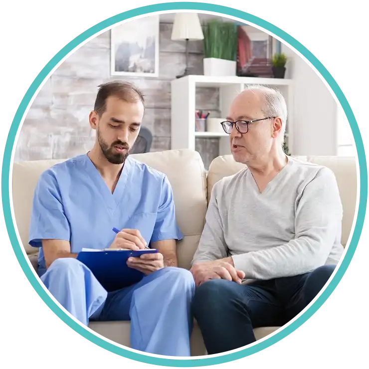 Doctor consulting adult patient during primary care visit