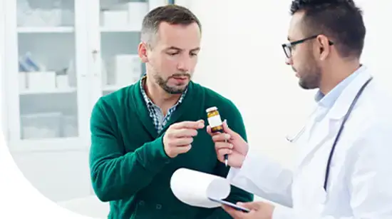 Doctor discussing medication instructions with a patient