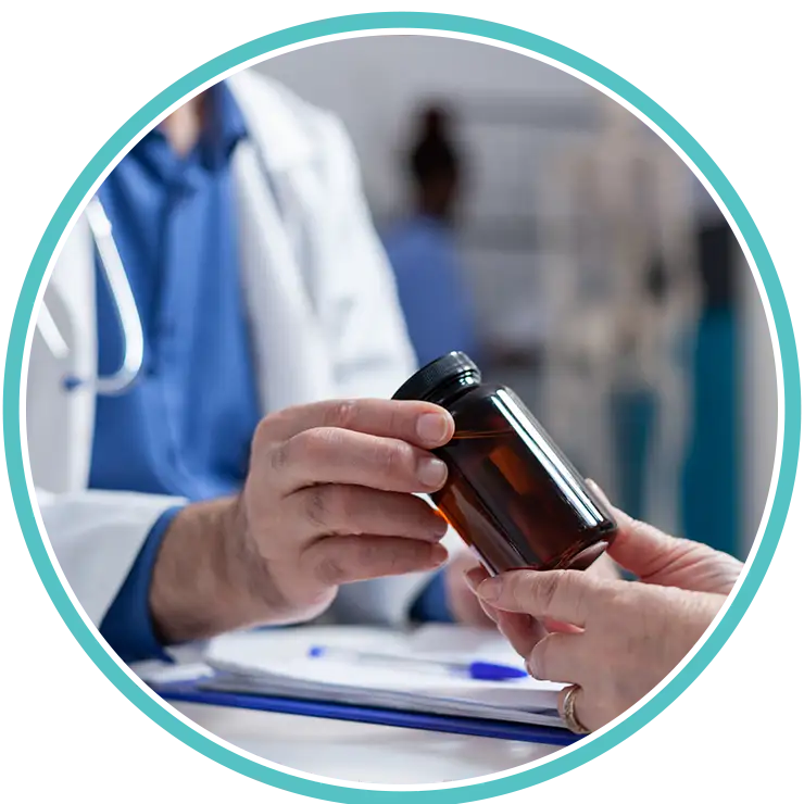 Doctor explaining medication bottle to a patient