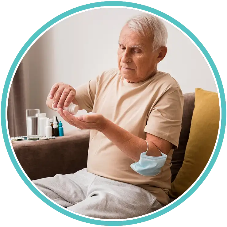 Senior adult taking daily medicine as part of treatment plan.