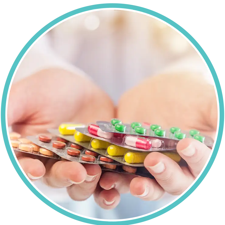 Healthcare professional holding multiple prescribed medications