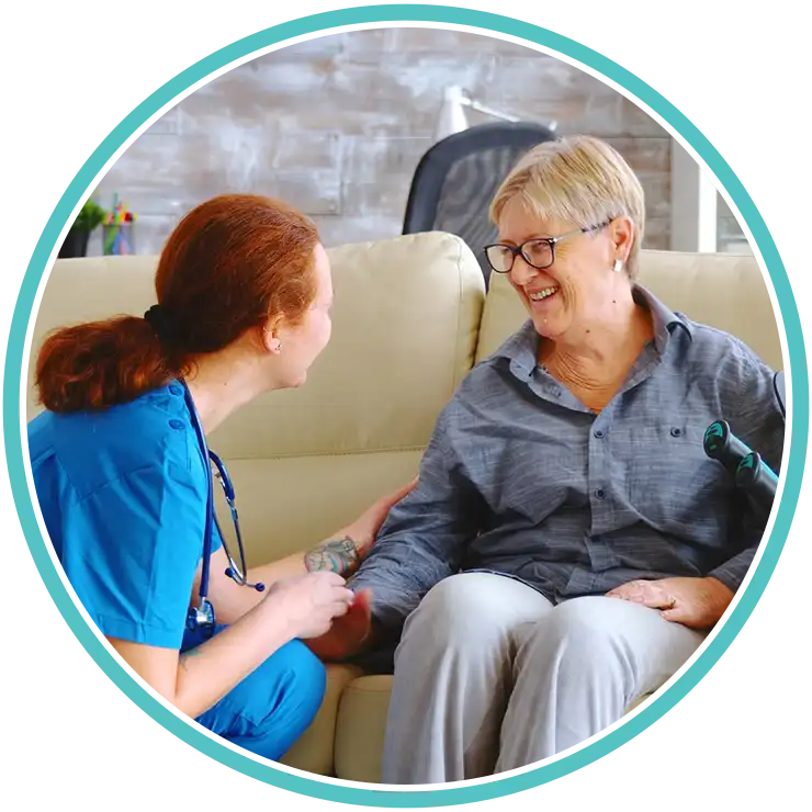 Nurse talking with an elderly patient during a primary care visit