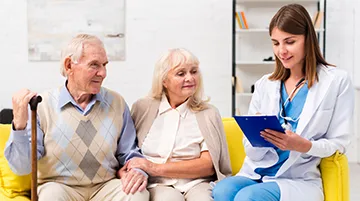 Doctor providing medical care to an elderly patient