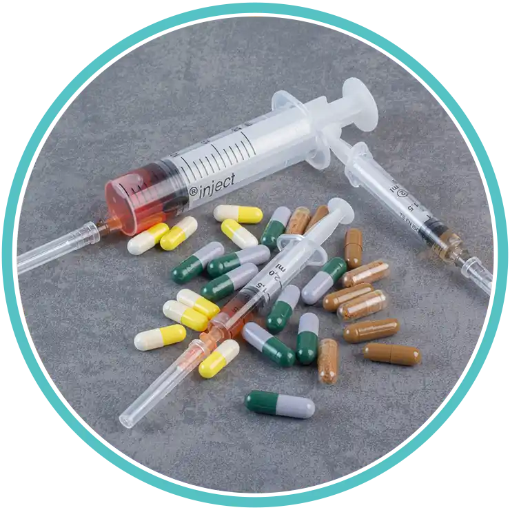 Selection of medical pills and syringes for addiction treatment in Robbinsville, NJ.