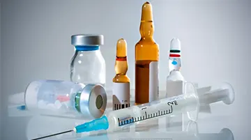 Healthcare provider preparing a long-acting injection for extended-release MAT.